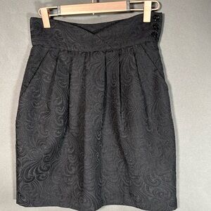 TV Series wardrobe. Black jacquard mini skirt, size 2, hand pockets